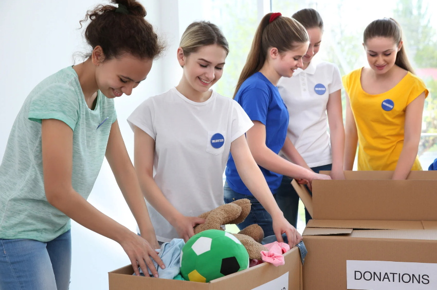 teens packing boxes of donations