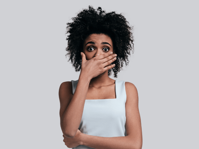 shocked girl with hand over mouth