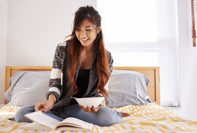 girl sitting on her bed