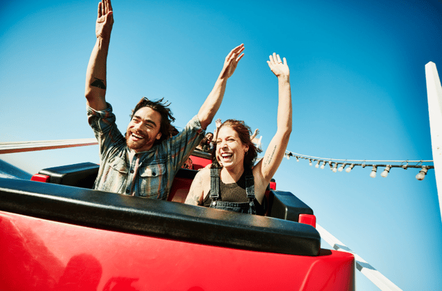 smiling couple on roller coaster