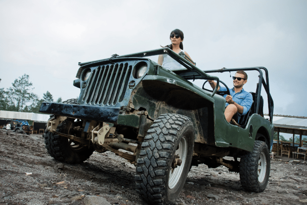couple in all-terrain jeep