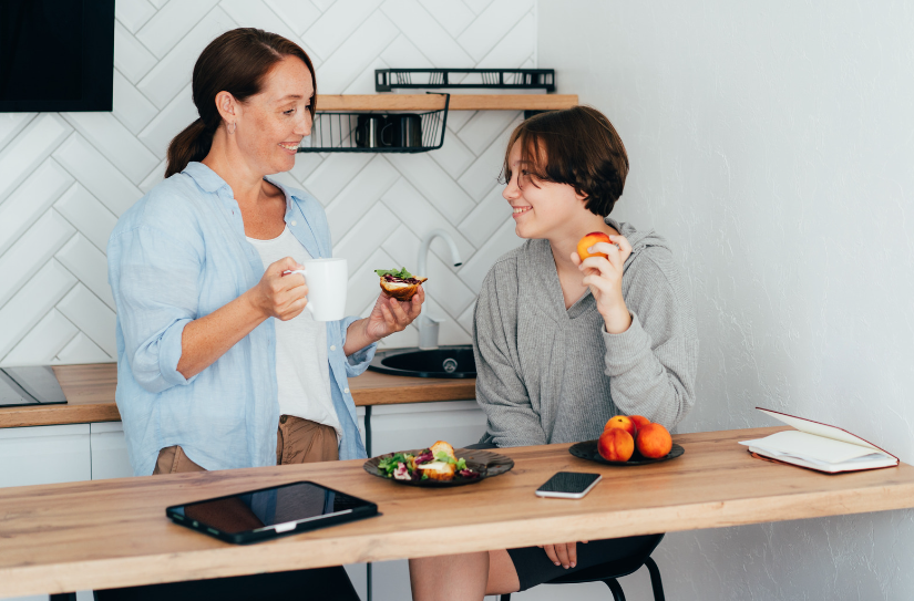 teen and mom talking in kitchen