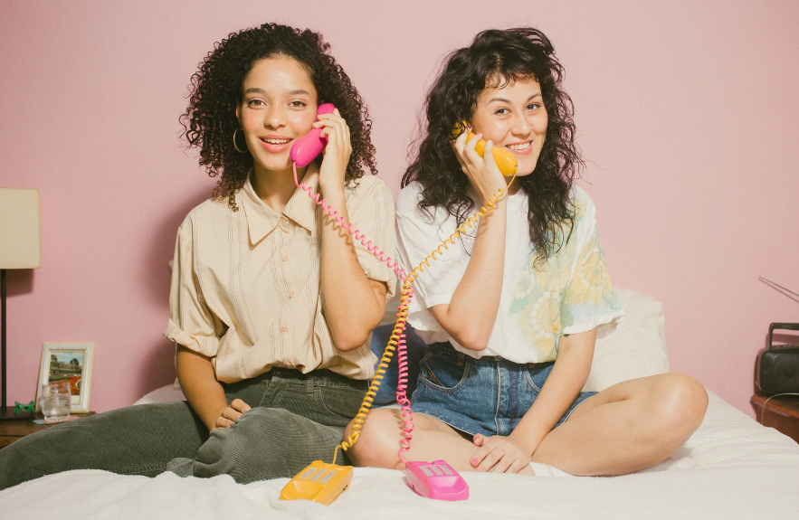 two women talking on the phone