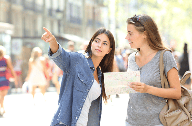 one teen girl giving another directions