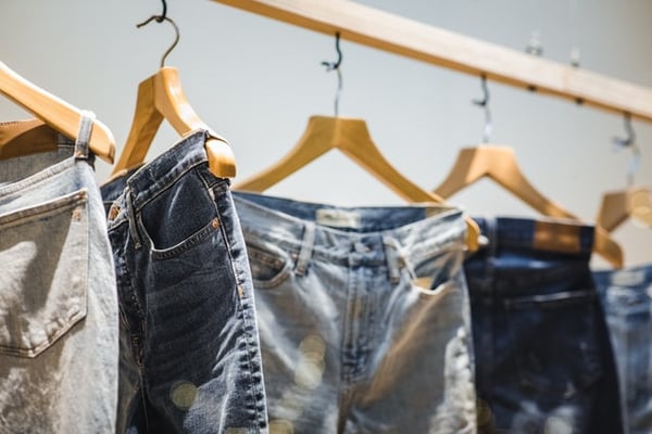 jeans hanging on a hanger 