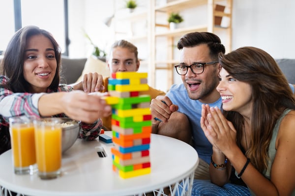 family playing jenga game