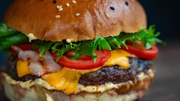 jumbo cheeseburger with onions lettuce and tomatoes