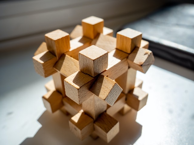 a wood puzzle with many pieces