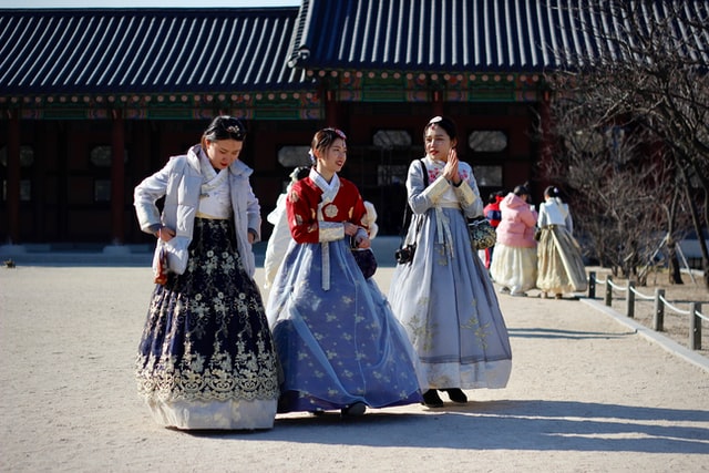 three korean teenage girls in traditional dress