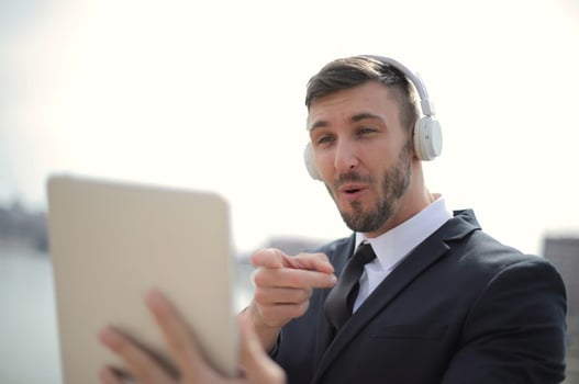 man having a conversation via tablet