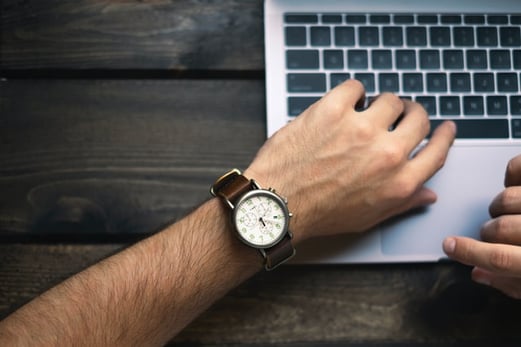 male hand over laptop keyboard