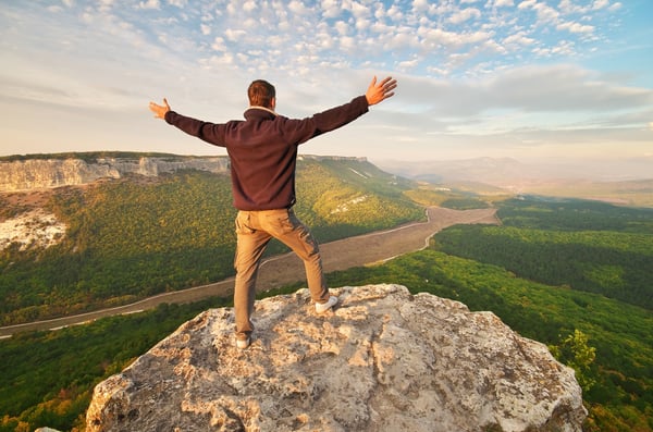 teen on top of mountain