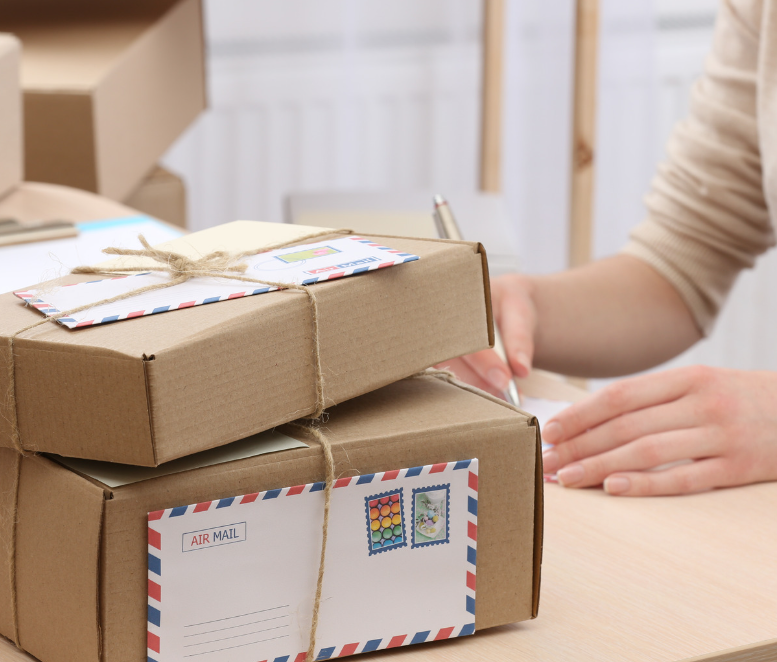 woman preparing care package to mail