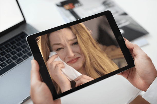 image of teenage girl crying on ipad screen during video call