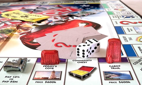 playing tokens on a Monopoly board