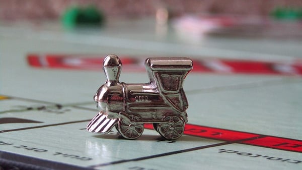 Monopoly train token on a space of the game board