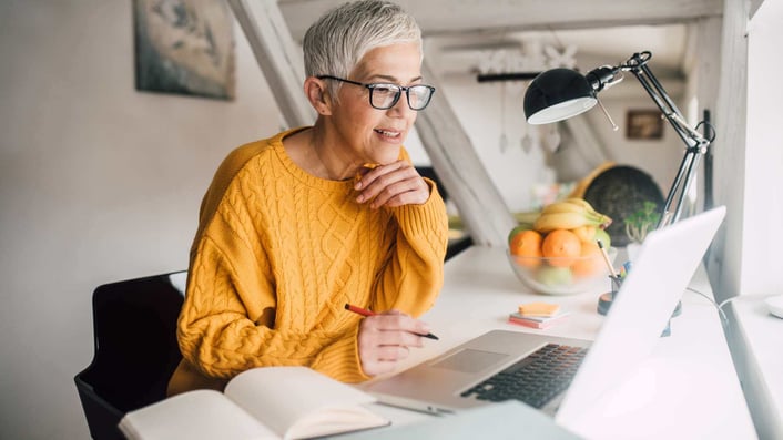 older woman working at her computer