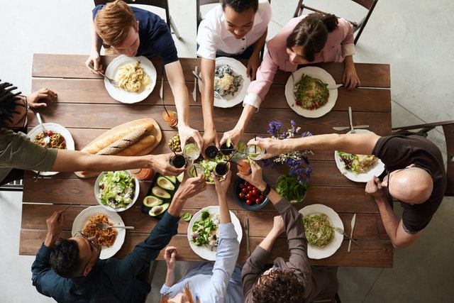 family toasting around dinner table