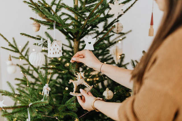 girl decorating the Christmas tree