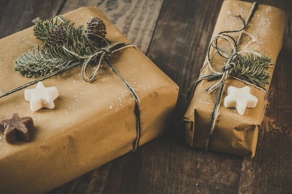 Christmas gifts wrapped in brown paper and string