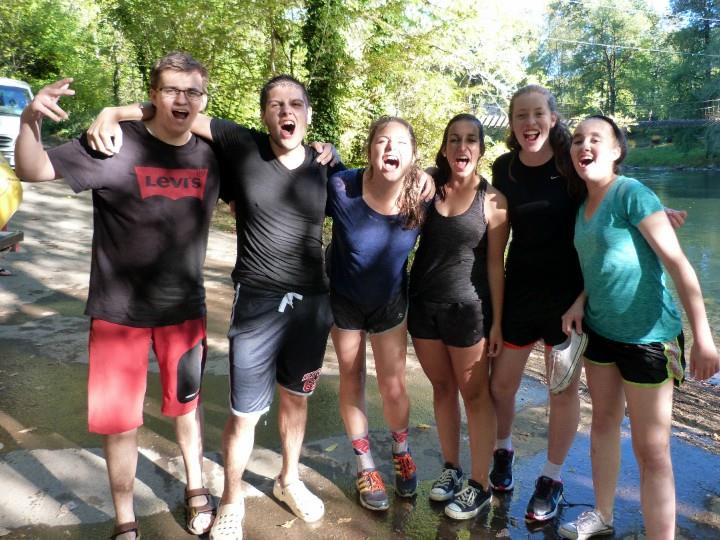 happy group of teens at the river