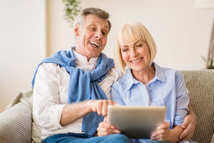 happy couple at computer