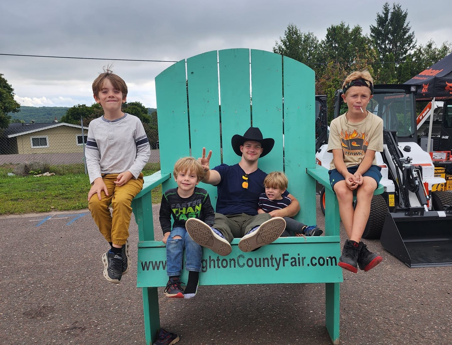 teen and younger kids on giant chair