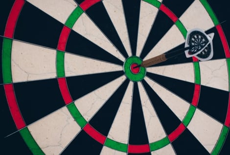 dart board with dart hitting the target