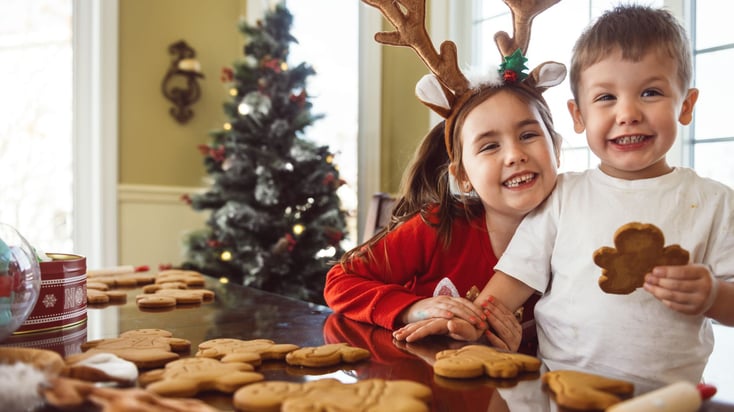 small boy and girl making Christmas cookies