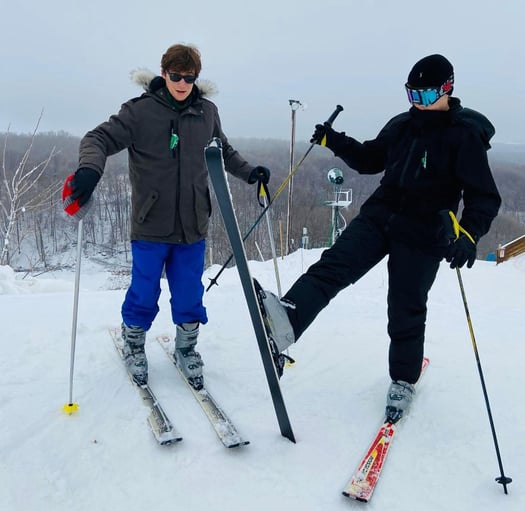 two teen boys skiing