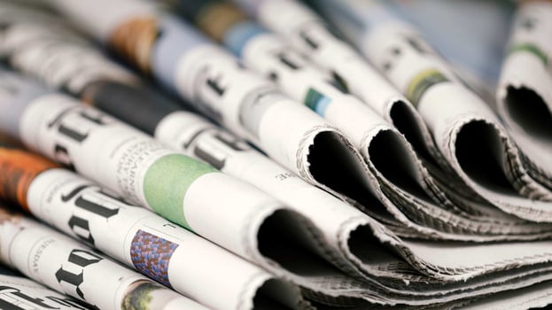 stack of several newspapers