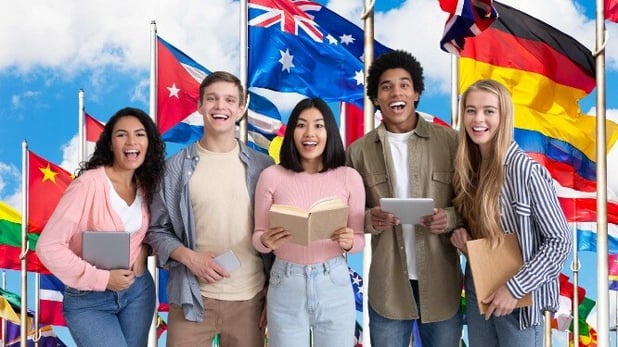 students from around the world with flags in background