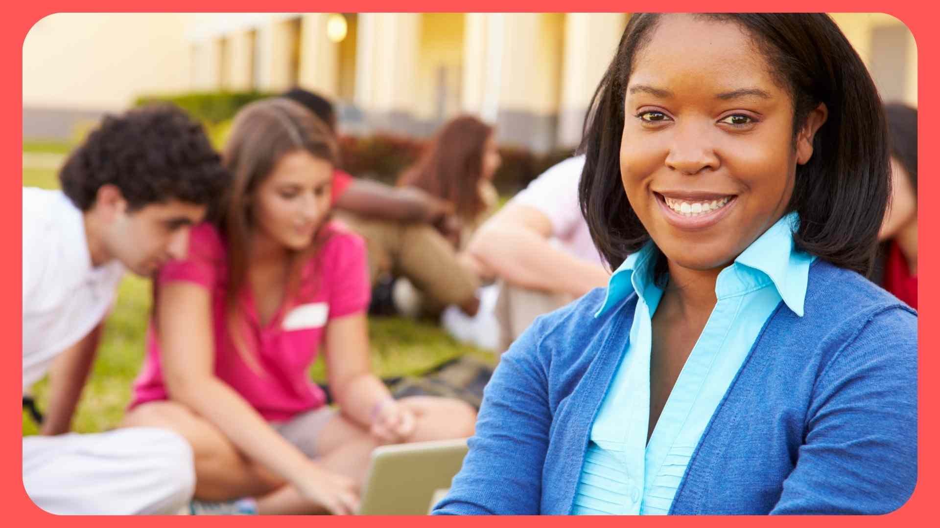 teacher with students in background outside