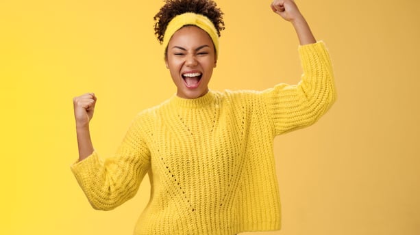 teenage girl cheering to show enthusiasm