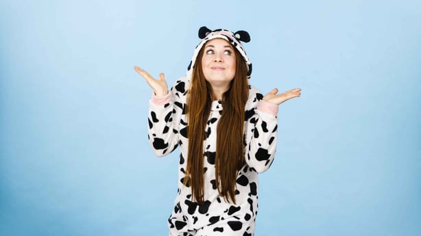 teenage girl wearing dalmatian onsie pajamas