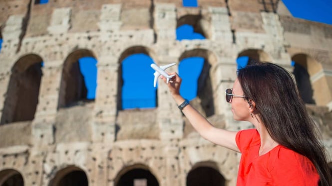 teenager in front of the colliseum of rome