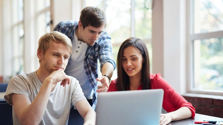 three teens taking an online course