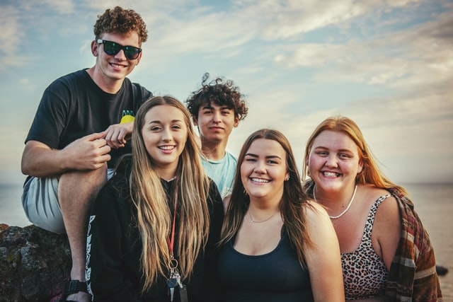 a group of smiling teenagers