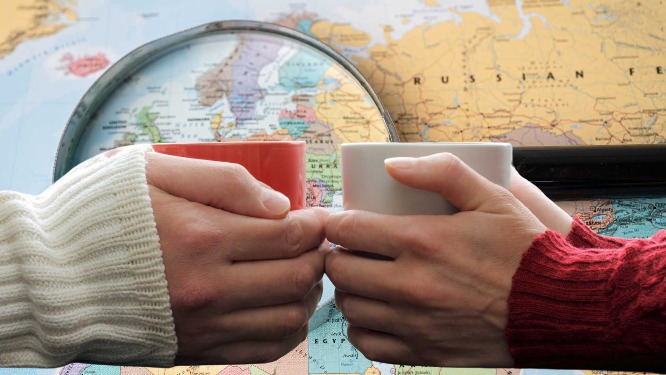 two mugs with map in background