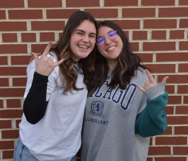 two teen girls smiling