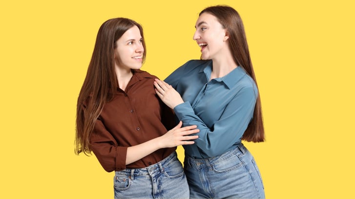 two teenage girls laughing together