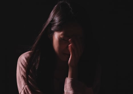 teen girl crying in the dark