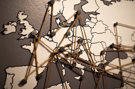 map of Europe with tacks and string marking travel routes