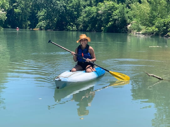 young girl in kayak in lake