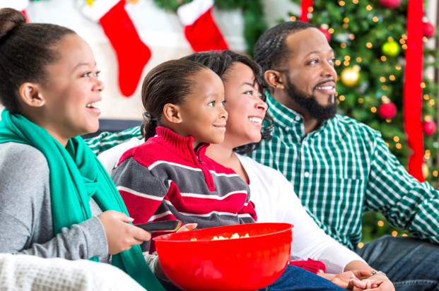 family watching movie with popcorn