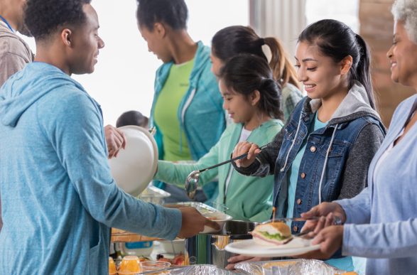 teen girl volunteering at soup kitchen