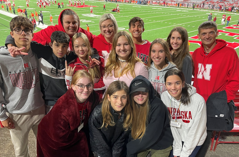 group of exchange students at football game
